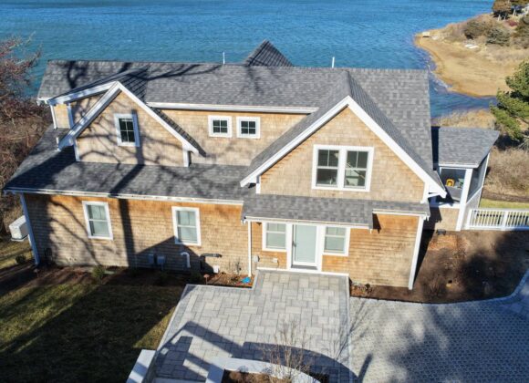 Cedar siding detail with white trim and coastal architecture