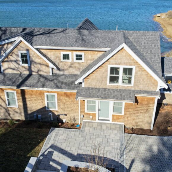 Cedar siding detail with white trim and coastal architecture