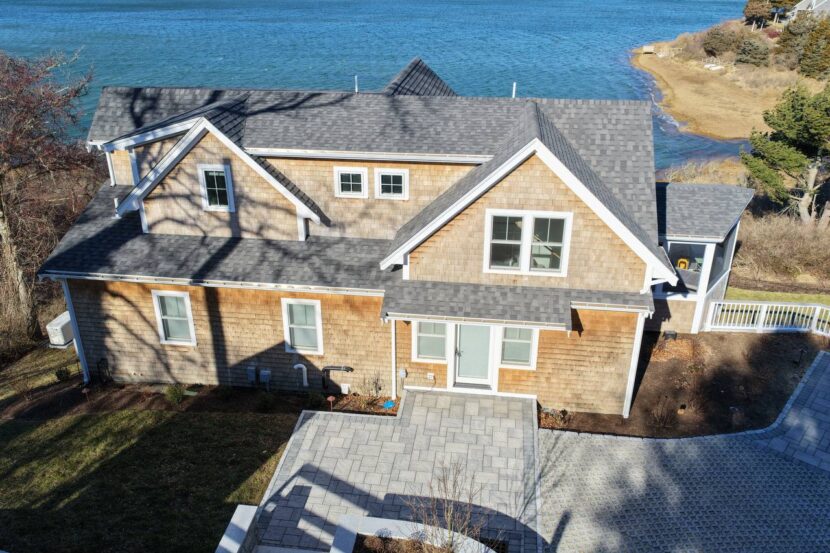 Cedar siding detail with white trim and coastal architecture
