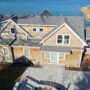 Cedar siding detail with white trim and coastal architecture